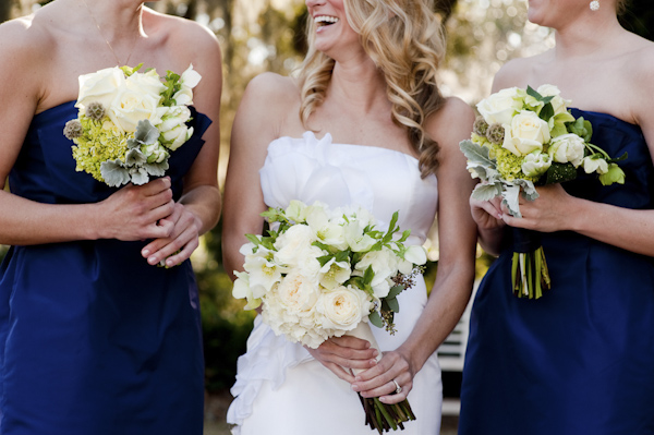 bride laughing with her bridesmaids - wedding photo by top South Carolina wedding photographer Leigh Webber